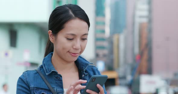 Woman Talk to Smart Phone in City