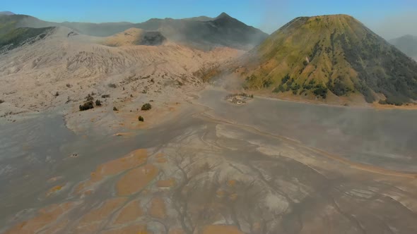 Aerial View on Famous Active Bromo Volcano or Mount Gunung Bromo and Batok Volcano Inside