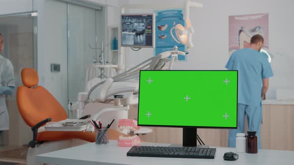 Horizontal Green Screen on Computer in Dental Cabinet