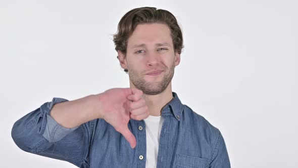 Thumbs Down By Disappointed Young Man on White Background