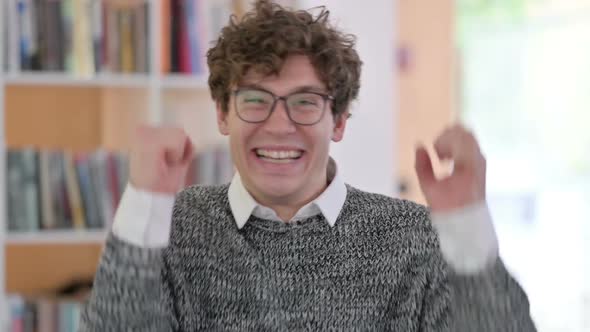 Portrait of Excited Young Man Celebrating