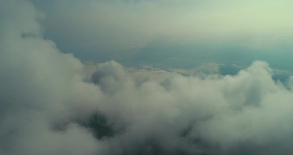 Aerial Fly Above Clouds with Blue Sky in Backgroubnd on Beautiful Sunny Day