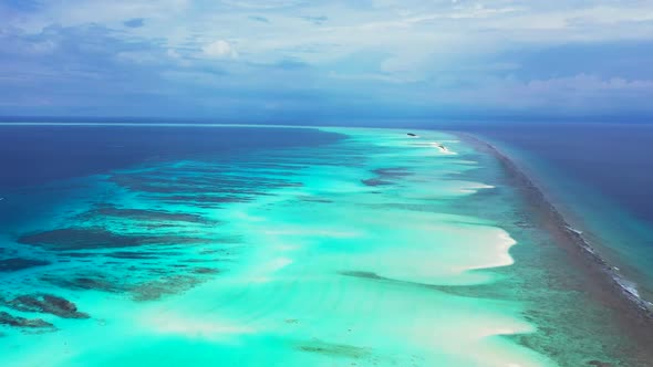 Aerial top down scenery of relaxing shore beach break by transparent sea with white sand background 