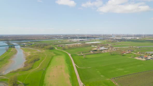 Aerial view approaching wind turbines in Dutch countryside