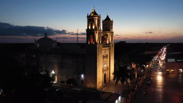 Aerial ascending nighttime view of the Cathedral de San Gervasio in Valladolid, Yucatan, Mexico.