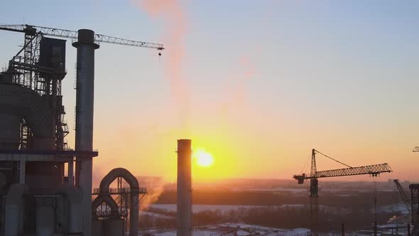 Aerial View of Cement Factory Tower with High Concrete Plant Structure at Industrial Production Area