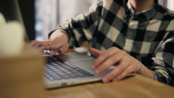 Accurate Female Hands Typing Something on Laptop Keyboard