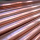 Metal, copper pipes stack with shiny reflections at warehouse. - VideoHive Item for Sale