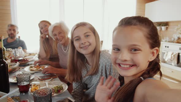 Pretty Girls Taking Selfie with Family at Home Dinner Party