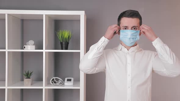 Doctor Removes the Protective Medical Mask and Looks at the Camera, End of Covid19 Quarantine