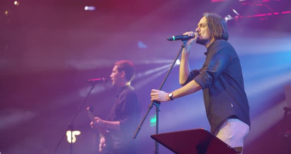 Expressive Singer Singing Into Microphone