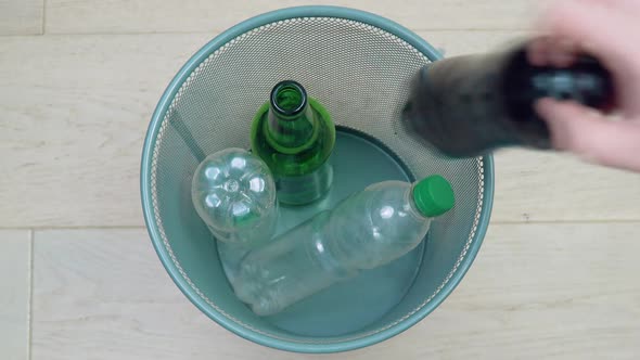 Man Picks Up Plastic Waste for Recycling