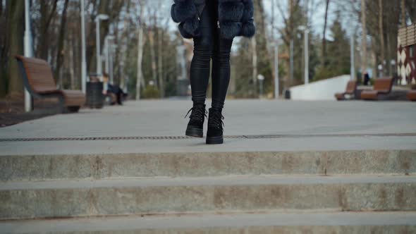 Beautiful woman walking in park. Close up of woman in casual clothes posing outdoors