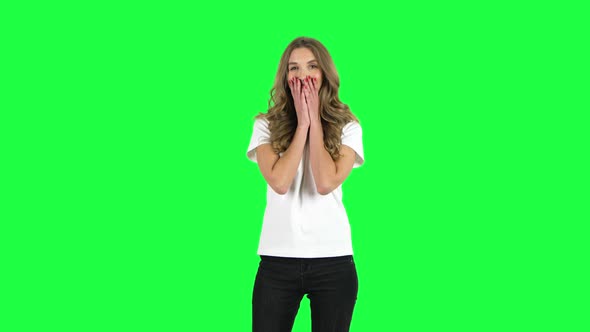 Lovable Girl Smiling While Looking at Camera. Green Screen