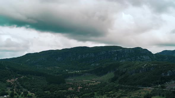 Timelapse of cloudsing over a mountain, majestic view and dark skies and insane cloudement