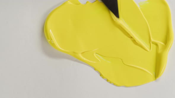 Mixing Yellow Paint Closeup