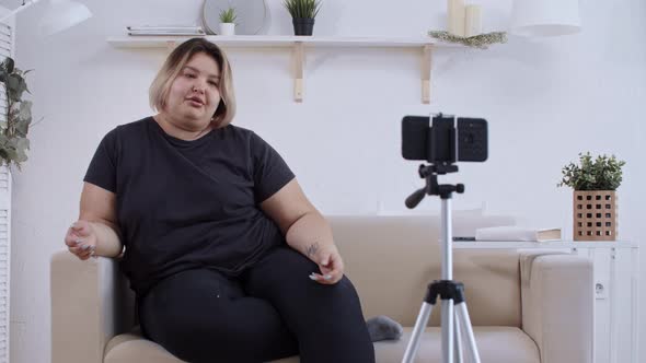 Body Positivity Confident Overweight Woman Feminist Lying on a Couch and Making a Video for Her