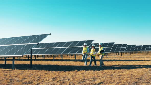 Walk Around Inspection at Solar Plant. Solar Power Plant Workers, Solar Energy Industry Concept.