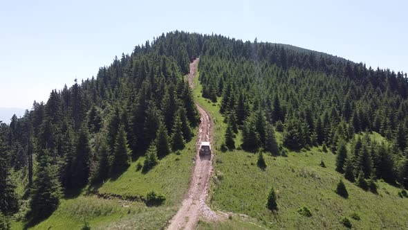 Big SUV Off Roading Into A Forest