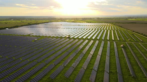 Aerial View of Big Sustainable Electric Power Plant with Rows of Solar Photovoltaic Panels for