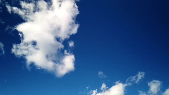 Blue sky with fasting clouds. Beautiful zoom in close up timelapse