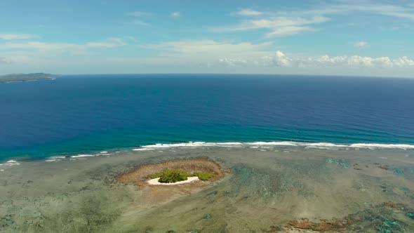 Tropical Island in the Blue Ocean Water