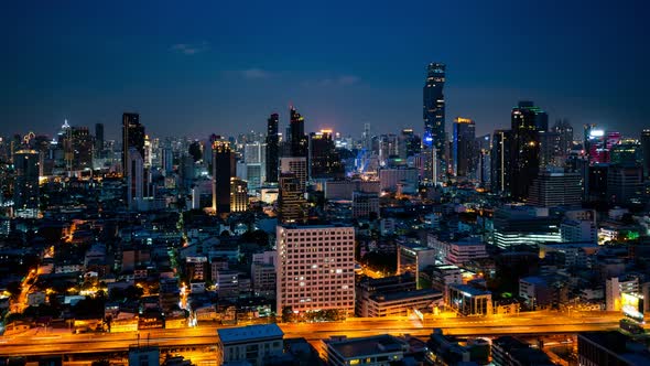 Day and night transition time lapse of cityscape and buildings in metropolis