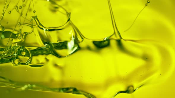 Super Slow Motion Shot of Pouring Fresh Green Olive Oil at 1000Fps