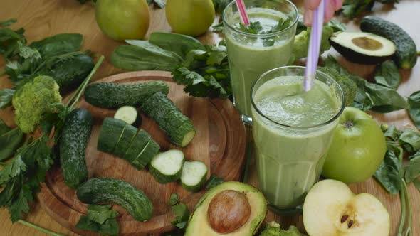 Organic Freshly Squeezed Green Vegetable and Fruit Smoothie Into the Glass