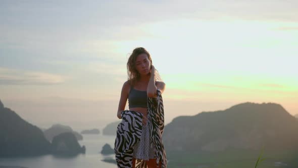 Woman Posing in Tunic Grey Top and Shorts During Sunrise on View Point