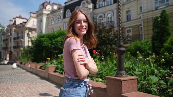 Beautiful Young Woman Tourist Walking in the City Center