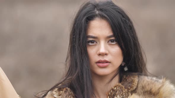 close-up portrait of a young Asian mestizo woman looking confidently into the camera with her head h