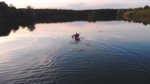 Man on Kayak and Sunset