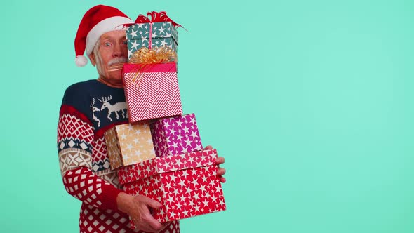 Senior Grandfather Man in Christmas Sweater Holding Many Gift Boxes New Year Presents Shopping Sale