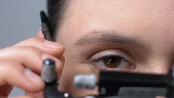 Lady Putting on Ophthalmic Testing Device for Eye Examination and Lens Selection