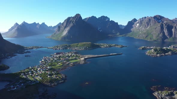 Flight over the sea and view on the fishing village Reine and Hamnoya ,Lofoten Islands,Norway