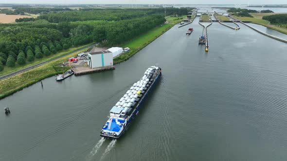 Vehicles Transported by Boat Entering the Volkerak Lock in the Netherlands