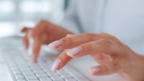 Female Hands Typing on a Computer Keyboard. Concept of Remote Work.