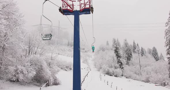 Winter Scene View of the Snowy Pine Forest and Ski Funicular in the Mountains