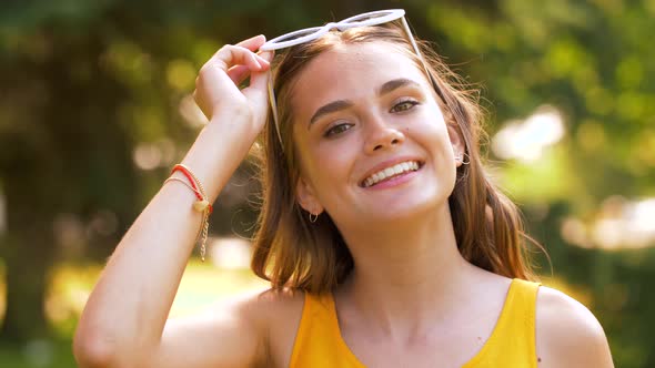 Portrait of Happy Teenage Girl in Summer Park