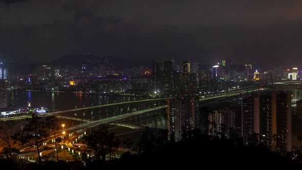 Macau – Zhuhai Border Earial Cityscape Night Timelapse Pan Up