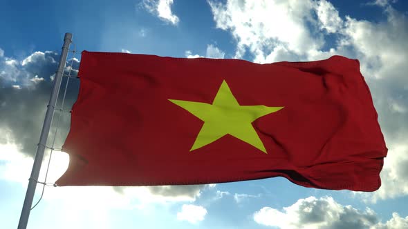 Vietnam Flag Waving in the Wind Against Deep Blue Sky