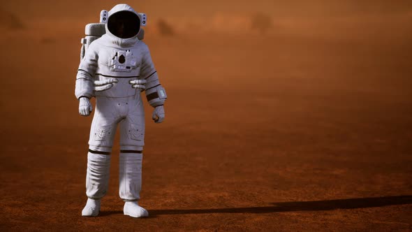 Astronaut on Mars Surface. Red Planet Covered in Gas and Rock