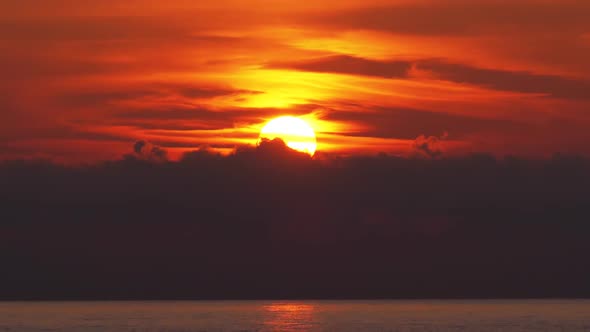 Sunset in the Clouds Over the Sea. Orange Path Sunset in the Sea