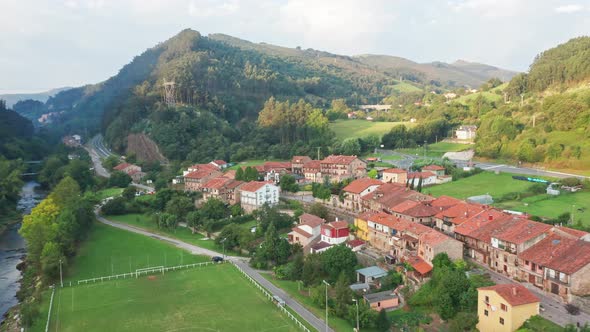 Typical north Spanish rural village in green natural valley. Aerial view