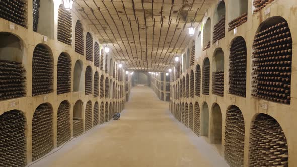 Wine Bottles Stacked Up in Underground Wine Cellar