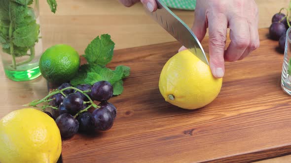 Lemon fruit cutting on the board for the lemonade or cocktail, close up view
