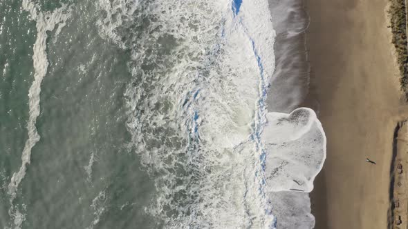 Ocean wave splash into the sand 