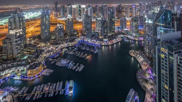 Dubai Marina Skyscrapers and Jumeirah Lake Towers View From the Top Aerial Night Timelapse in the