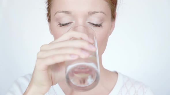 Woman Drinks Water on White Background